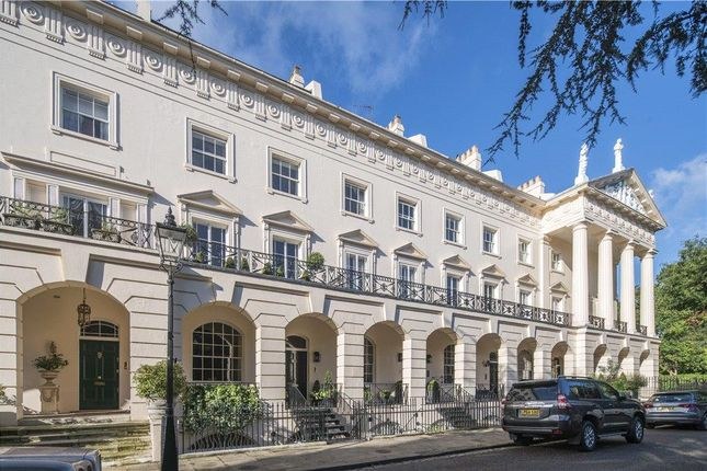 Grand listed Regency stucco terrace with heritage timber sash windows