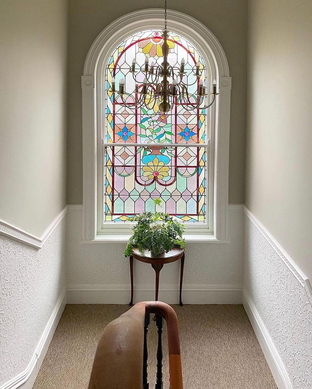 Restored stained glass staircase window